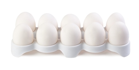 a dozen eggs on a white background isolatedの写真素材