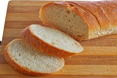 loaf of bread on a board groovedの写真素材