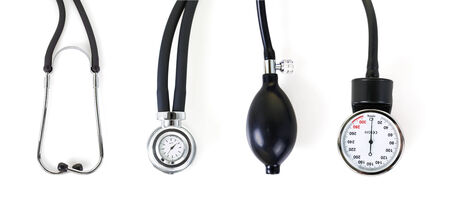 Medical kit, consisting of a tonometer and a stethoscope on a white background