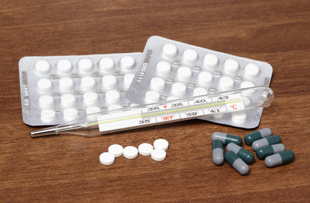Pills and tablets, on a dark table