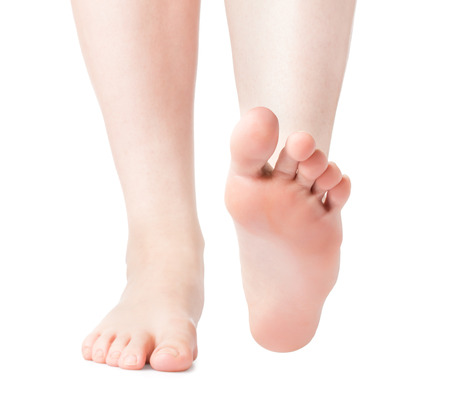 Woman foot on white background, isolated, close-upの写真素材