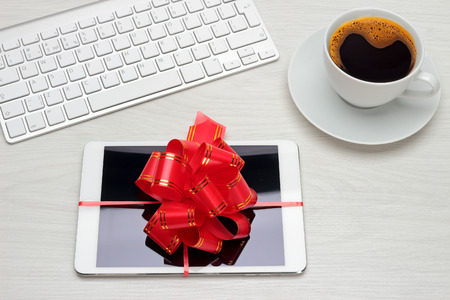 Gift for the holidays tablet with a bowの写真素材