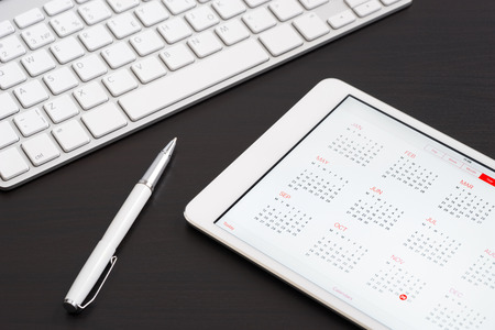 Tablet computer on on the black table, keyboardの写真素材