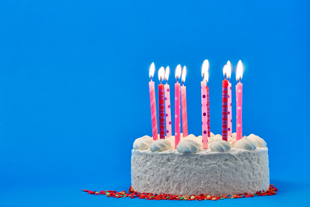 Birthday cake on a colored backgroundの写真素材