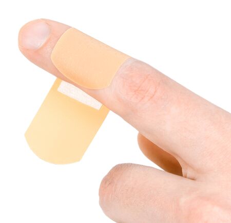 Adhesive bandage on finger on white background.の写真素材