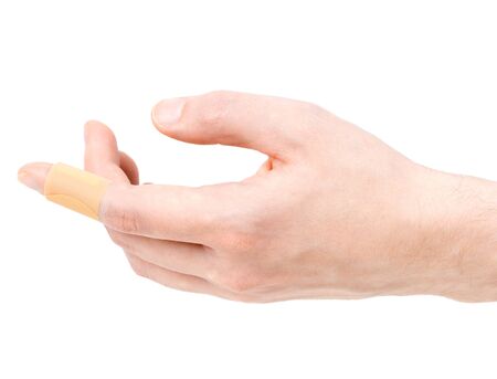 Adhesive bandage on finger on white background.の写真素材