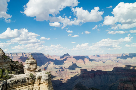 Man standing looking at epic view of the Grand Canyon National Park, Arizona, USAの写真素材