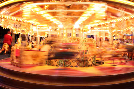 Slow movement of a carousel ride at a fair.の写真素材