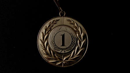 Gold, silver, bronze medals and cups on a black background. A large number of significant awards for performances in front of people and high-level sporting achievementsの写真素材