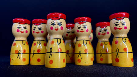 National Russian wooden toys painted according to a special technique. Nesting dolls painted with multi-colored paints on a black backgroundの写真素材