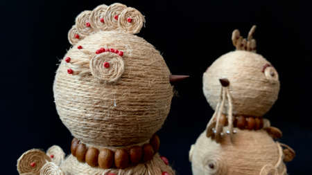 Handmade crafts using jute filigree technology. Domestic hens, chick and brown rope eggの写真素材