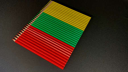 Abstraction from pencils for drawing. Pencils folded into the flag of Lithuania