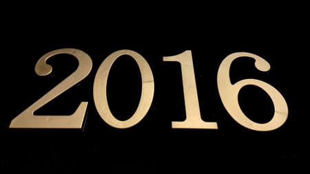 Gold numbers on a black background symbolize a date or designate something