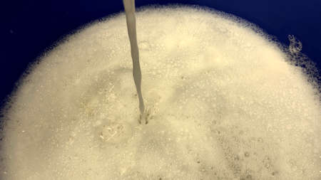 Body skin washcloth in foam with self-care cleanser, a person is preparing to take a bath