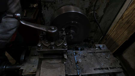 Industrial lathe for metal on which the foreman of the shop for the creation of fittings works