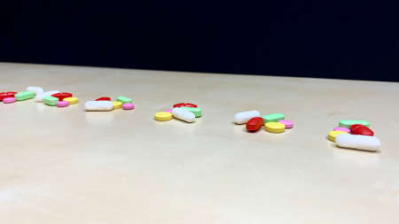 Set of pain medication pills in different colors. Vaccine and antidote in bright capsules