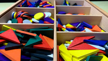 Set with wooden figures for children to explore shapes, colors and develop fine motor skills