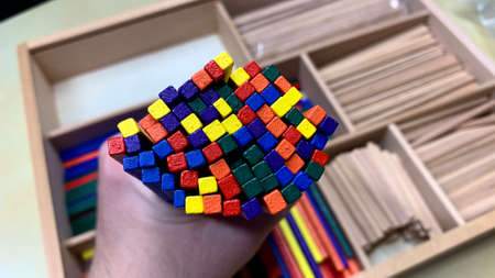 Wooden set with multi-colored sticks for the development and education of children in kindergartenの写真素材
