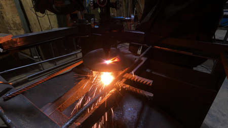 Gas cutting machine for metal carving at the factory. The master works with a machine for cutting...
