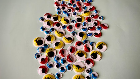 Decorative plastic multi-colored eyes for decorating toys and handmade crafts. Abstract image of...