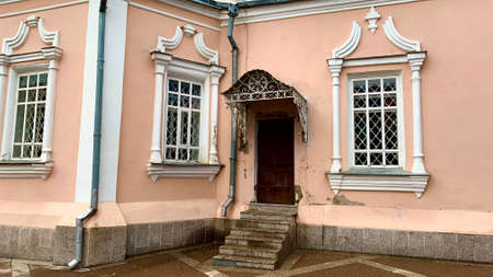 Reconstruction of an old Christian church. Temple of Jesus with a bell tower, a golden dome and a cross. Painting of the old facade of the buildingの写真素材
