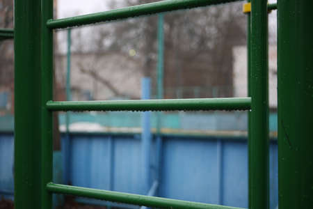 City playground for sports. Metal structures for pull-ups. Horizontal bars, bars, ladders made of...