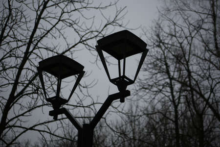 Street decorative lamp in the park for walking. black metal lamp