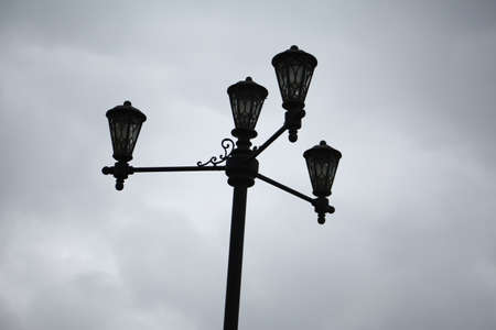 Decorative black lantern to illuminate the park for people walkingの写真素材