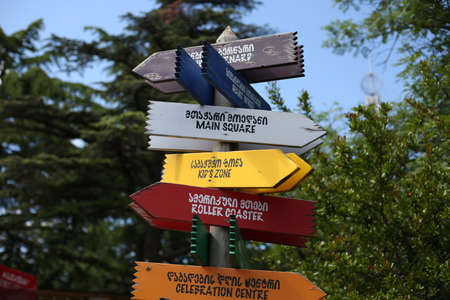 Wooden sign in the amusement park in English and Georgianの写真素材