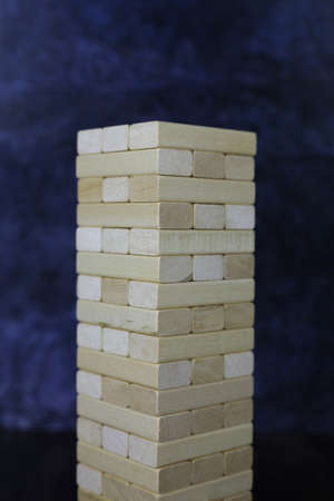 Board game with wooden bricks. block game, wooden tower for playing with friendsの写真素材