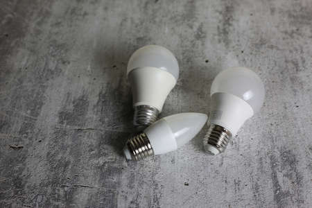 Diode light bulbs on a white background. Light bulbs of different shapes lie on the tableの写真素材