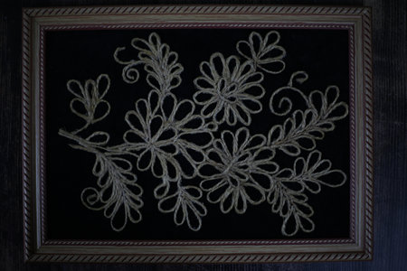 Three-dimensional picture in a wooden jute frame. brown rope crafts