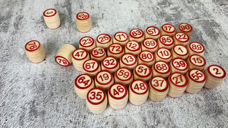 Loto game on the table. Wooden barrels for a board game with family and friends