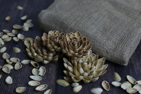 Craft flower from pistachio shell. Garbage from pistachios for flower arrangement artの写真素材