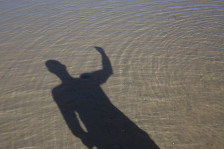 Shadow bodybuilder on vacationの写真素材