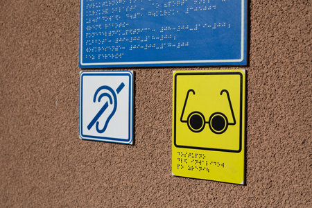 Blind and deaf person icon next to braille text for information for people with disabilities. Social...