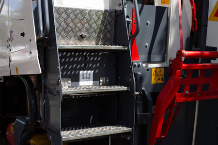 Ladder on rear of special equipment for climbing into cabin. Climb into the driver seat of special...
