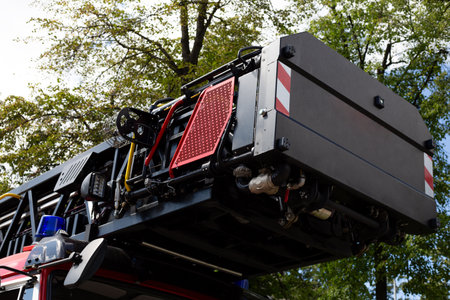 Folded ladder on the roof of fire vehicle. Long telescopic ladder for unfolding of accident....
