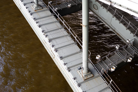 Close up of bridge metallic structure, focusing on robust connections and reinforced beams,...