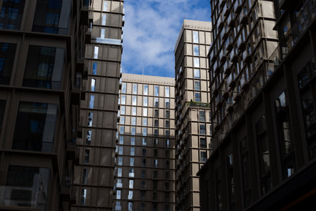 Modern residential buildings with sleek design and large windows, showing contemporary architecture....
