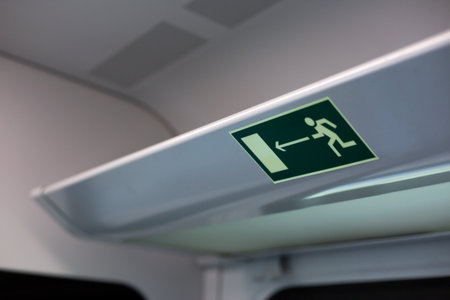 Train emergency exit sign, highlighting the safety measures in place for passengers. It emphasizes evacuation procedures, ensuring safe journey for everyone on boardの写真素材