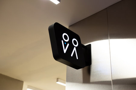 The entrance to men and women restrooms is marked with universal signs for easy identification. Sign on the wall indicates the restroom. Public hygiene concept. Modern restroom interiorの写真素材