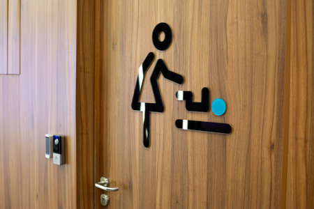 Baby changing room. Created conditions in public place for parents with infants. Public restroom with diaper changing room. Concept of parenting, accessible environment and family careの写真素材