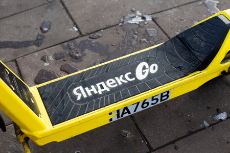 Moscow, Russia, November 16, 2025: Electric scooter rental deck with Yandex Go logo. The most popular service for renting personal transportation by minute or hour. Yandex scooter rentalのeditorial素材