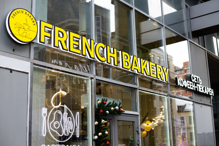 Moscow, Russia, November 16, 2025: The sign for French Bakery coffee shop chain hangs above large glass facade. News and an article about the French Bakery franchiseのeditorial素材