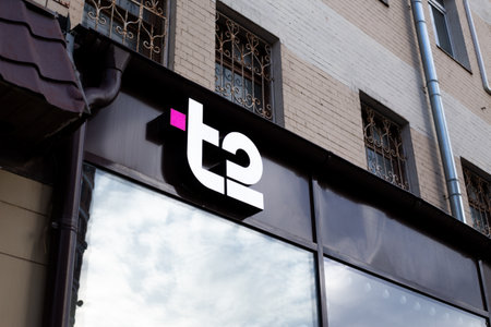 Moscow, Russia, November 16, 2025: The T2 logo on black facade of building. Telecommunications company founded by Swedish group Tele2 AB using networks acquired in Russian Federationのeditorial素材