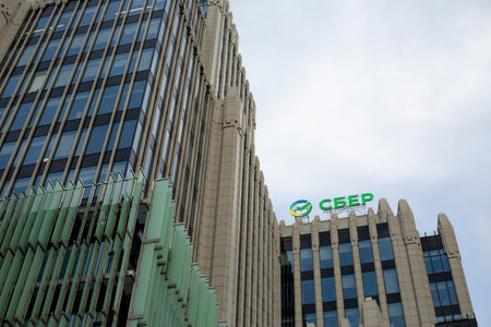 Moscow, Russia, November 16, 2025: The Sber logo on Oruzheyny business center building. Sberbank office. Background photo for news stories and articles about Sberのeditorial素材