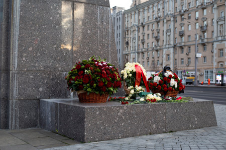 Moscow, Russia, November 16, 2025: Flowers at Mikhail Kalashnikov monument. Baskets of flowers honor the creator of the iconic Kalashnikov AK 47 assault rifleのeditorial素材