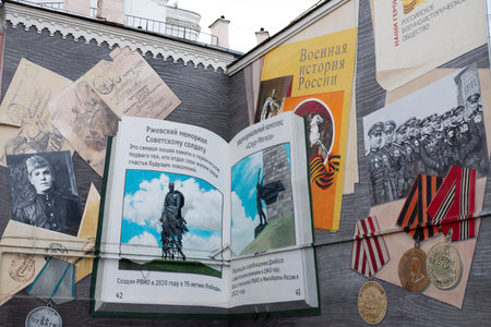 Moscow, Russia, November 16, 2025: Mural on building on Sadovaya Karetnaya Street. Formerly art object dedicated to Soviet pilots. Updated art to war heroes with other memorials on pages of bookのeditorial素材