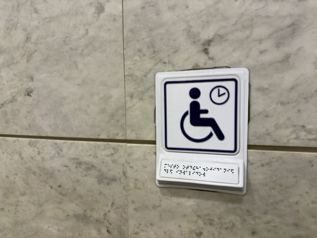 The accessible sign with Braille text for reading using tactile dots. The concept of finger reading...